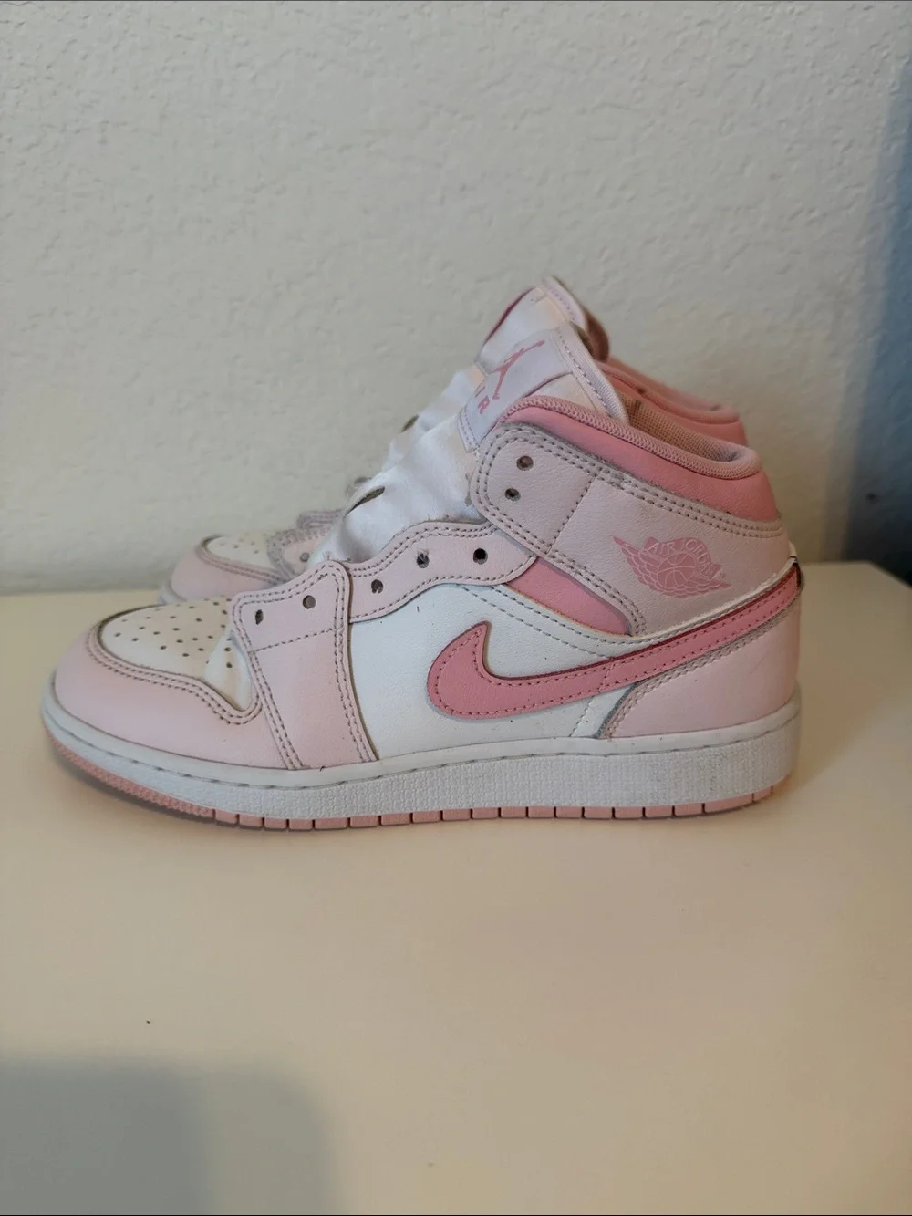 Nike Air Jordan Kids Pink and White High-Top Sneakers with Pink Swoosh